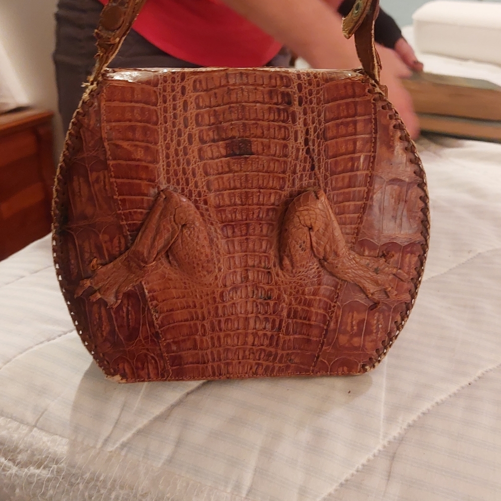 Vintage Alligator purse never carried. Brown Alligator head front legs in back.